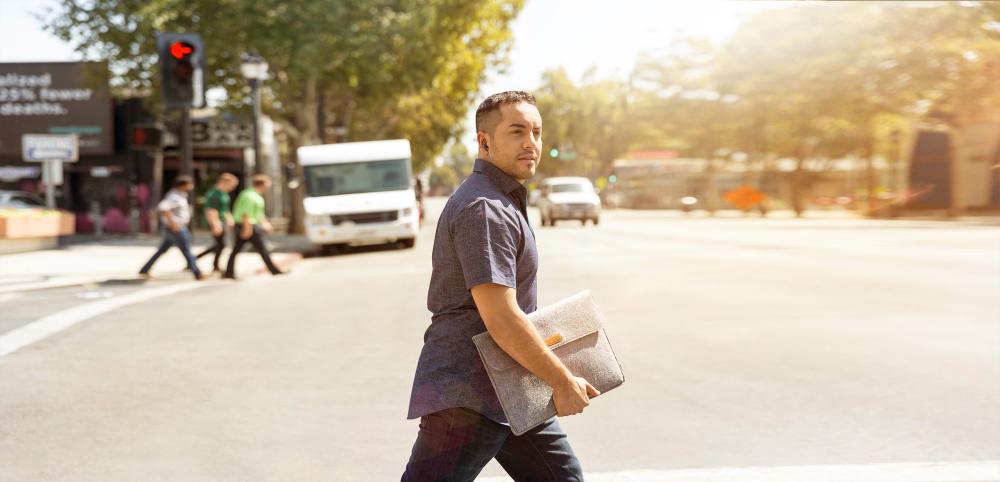 guy walking across the street