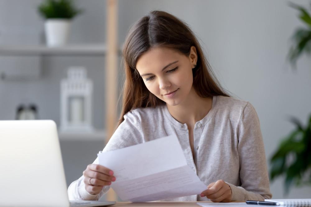 girl looking at paper